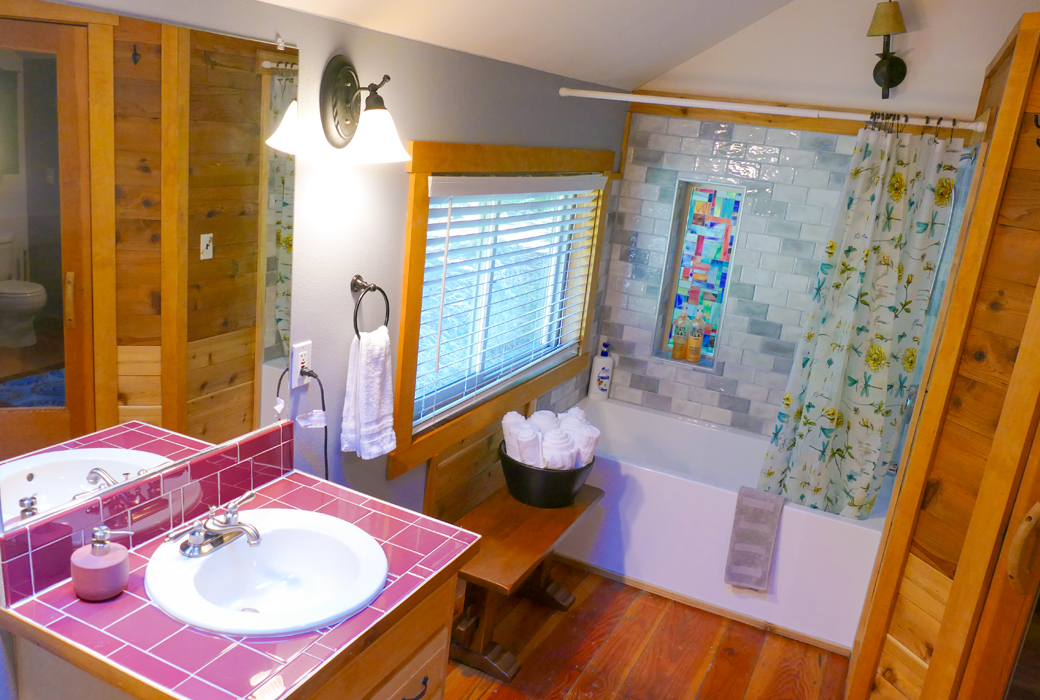 Bath with tub, shower, toilet plus washer and dryer.